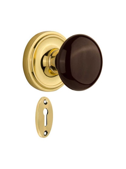 Classic Rosette Mortise-Lock Set with Brown Porcelain Knobs in Polished Brass.